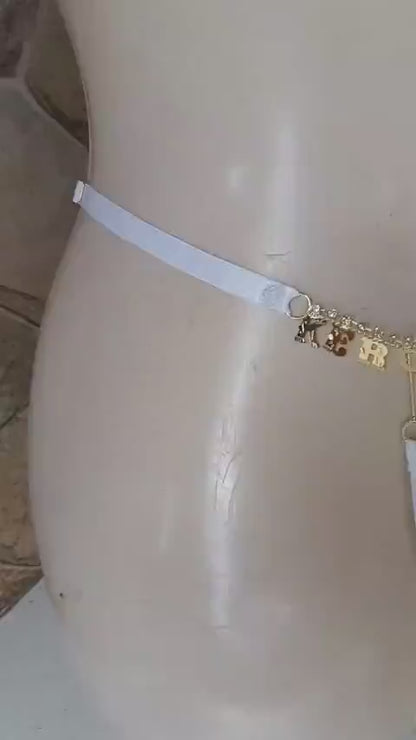 Calcinha fio dental sexy pingente, com frase em biju e detalhe de strass com regulagem plus size 36 ao 54